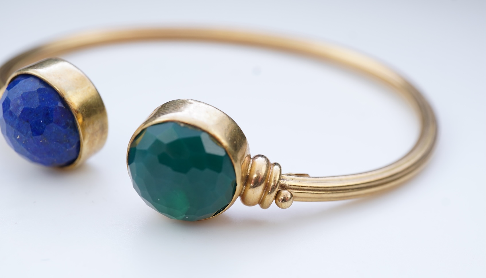 A gold, lapis lazuli and green chalcedony bangle